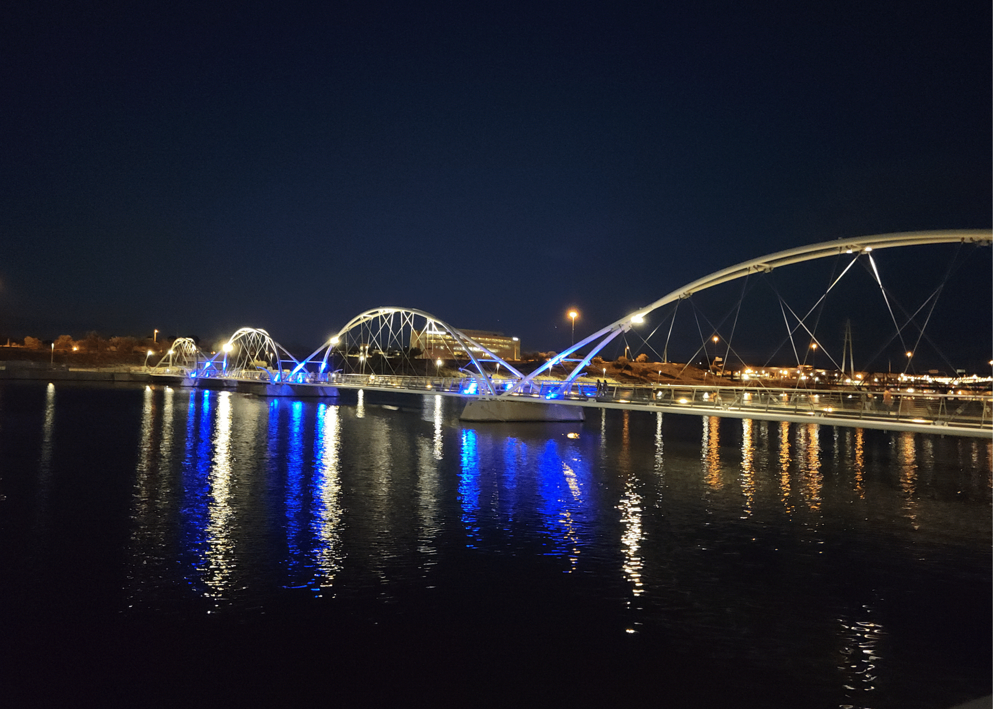 Elemore Pedestrian Bridge at Tempe Town Lake lit up at night