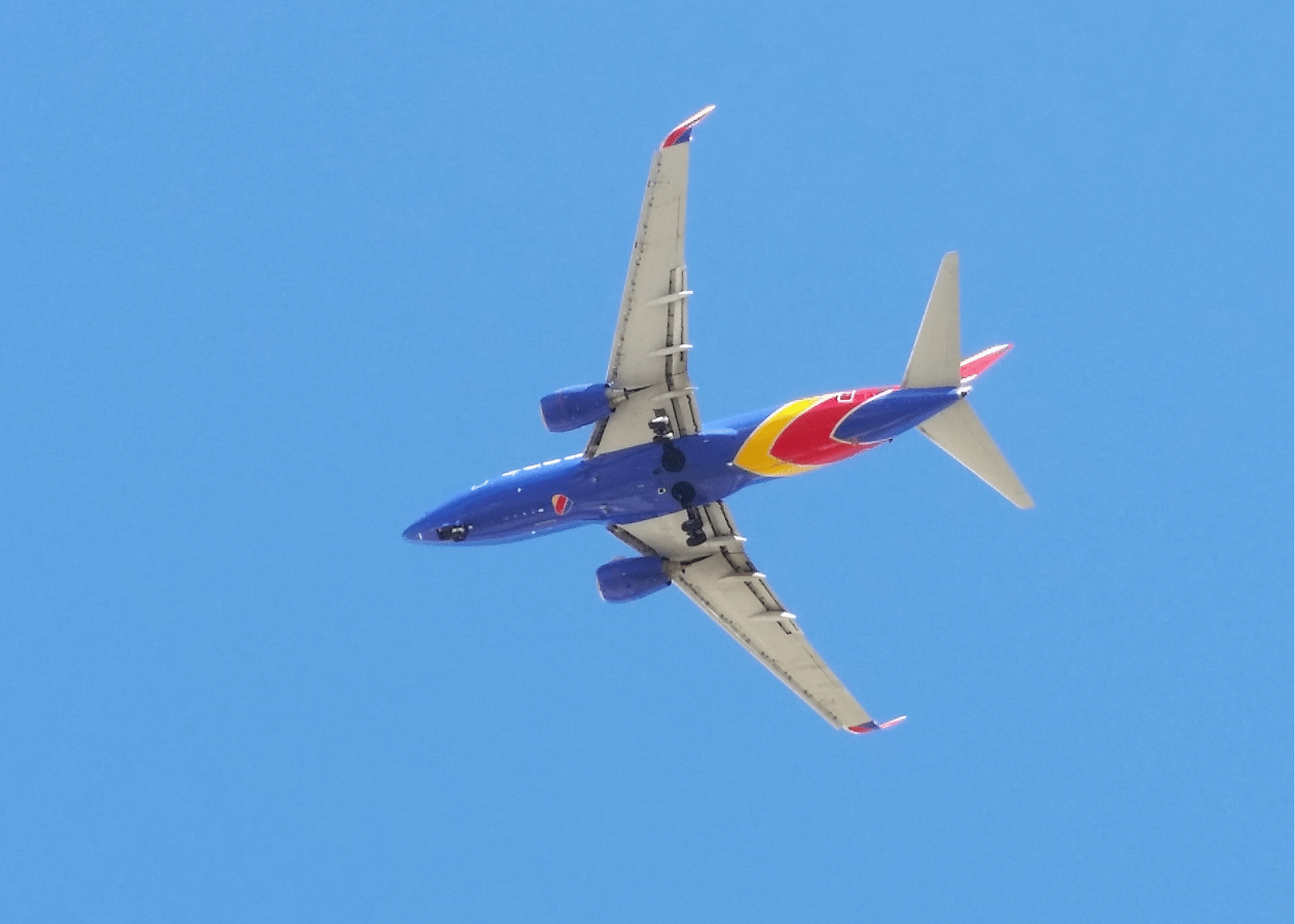 Airplane flying overhead getting ready to land at Phoenix Sky Harbor airport