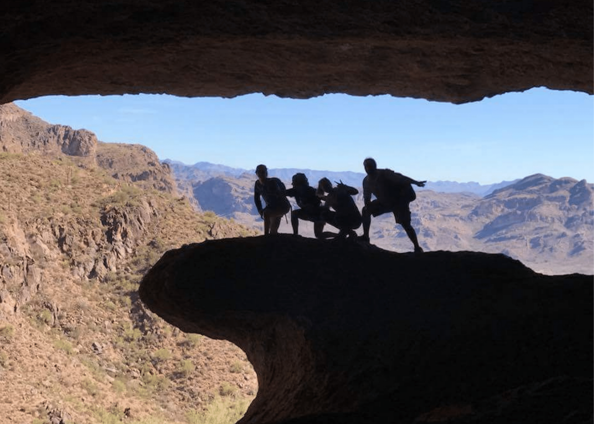 4 people posing like surfers at Wave Cave - activity in the Valley of the Sun