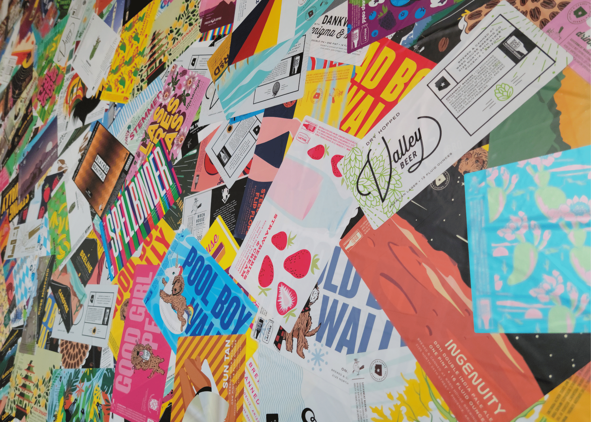 A wall at Wren House Brewery covered with beer can labels