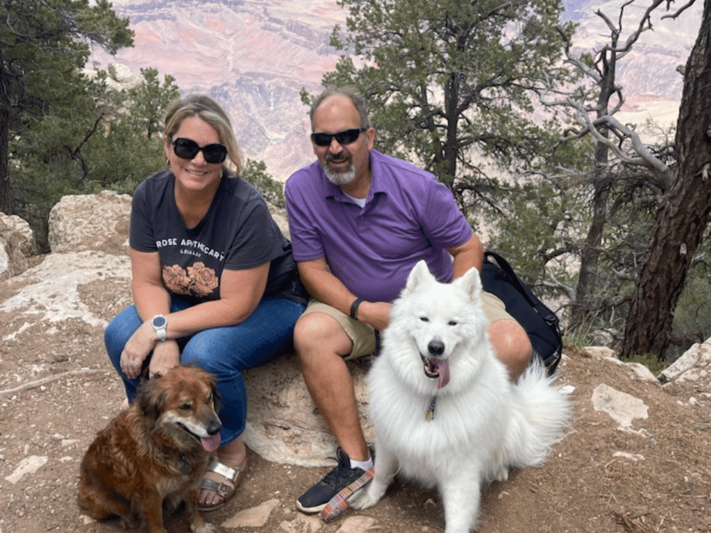 Sitting on a rock at the Grand Canyon with our dogs