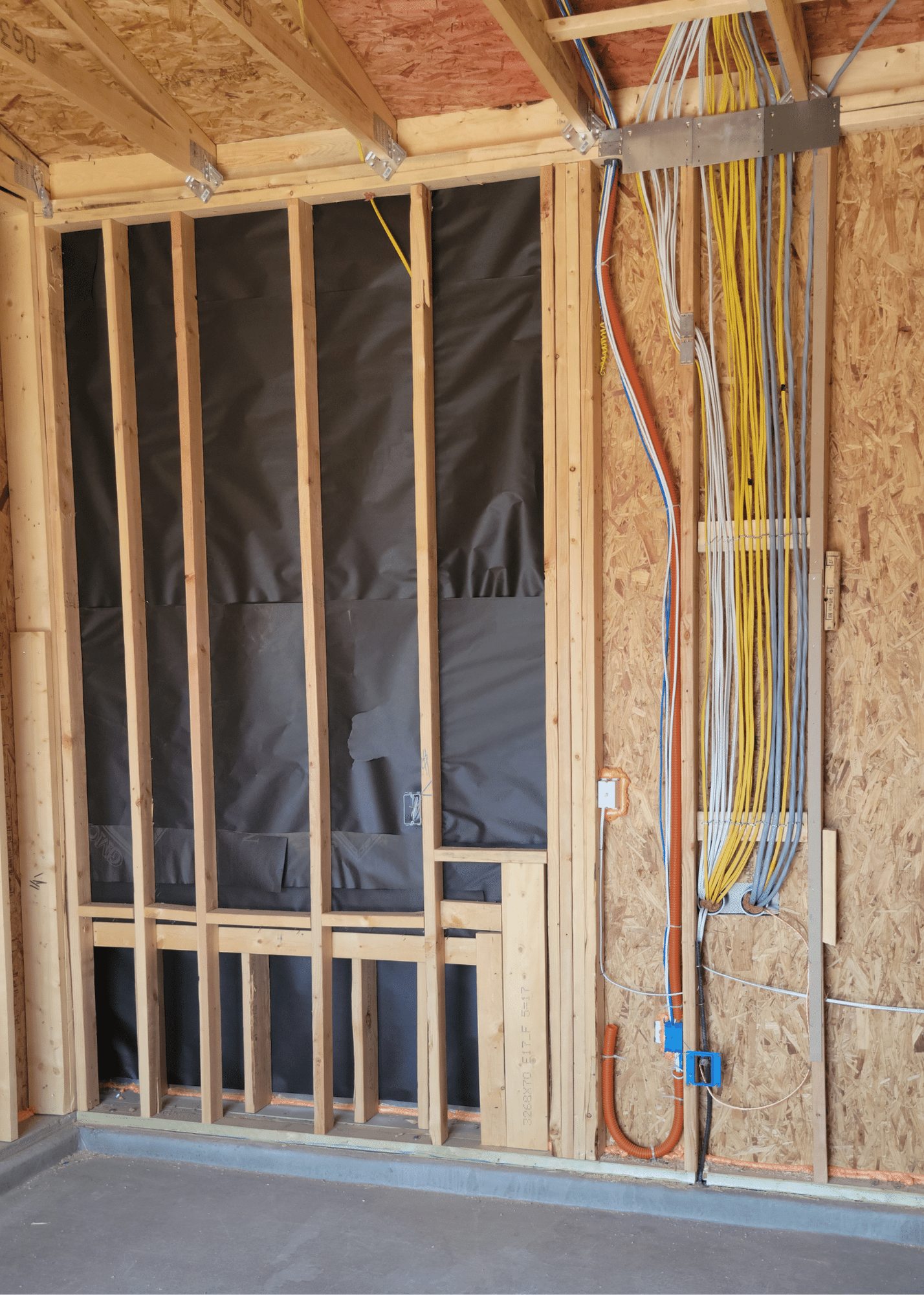 Framed wall with wiring and plumbing